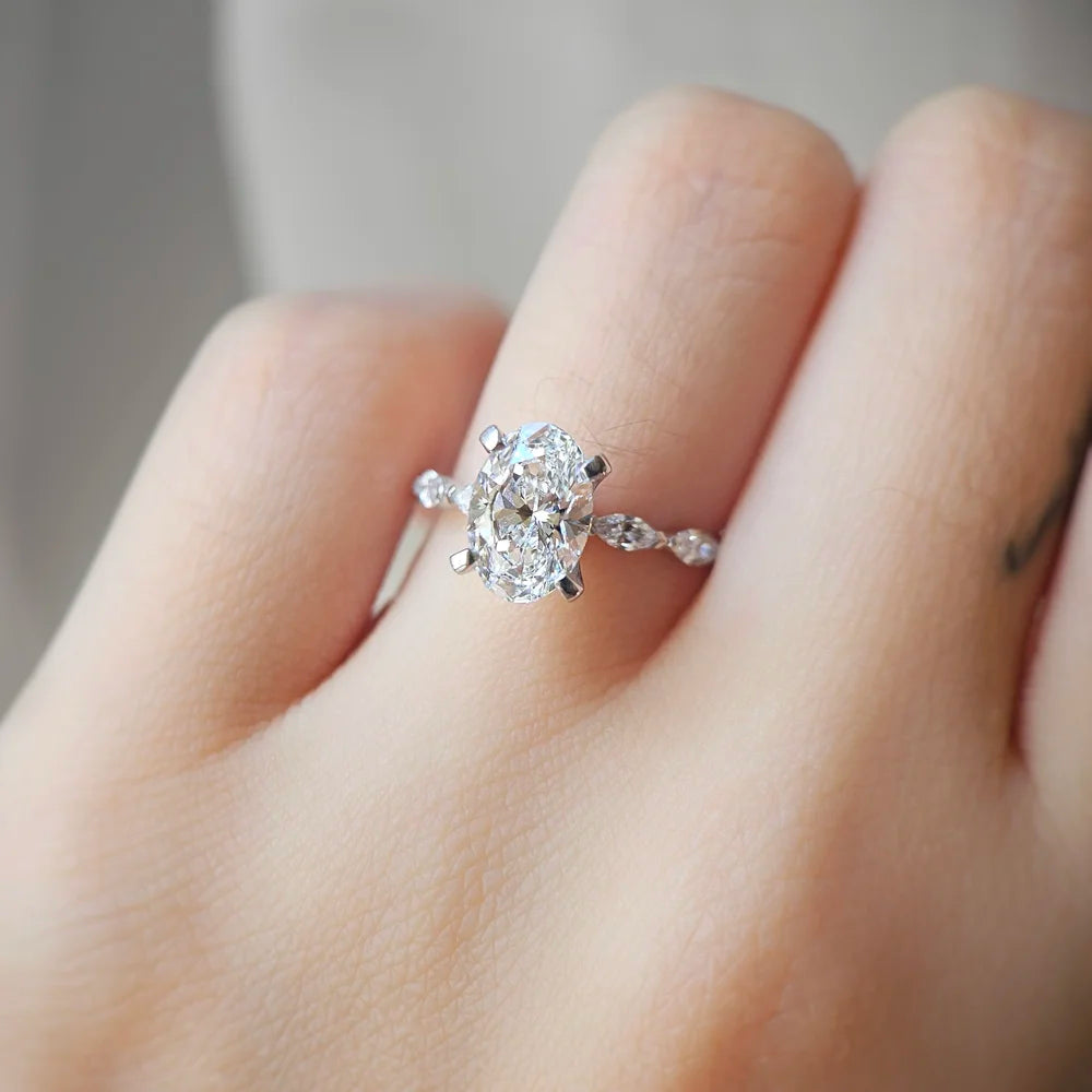 18K Odette Solitaire Oval Moissanite Ring with Round & Marquise Band