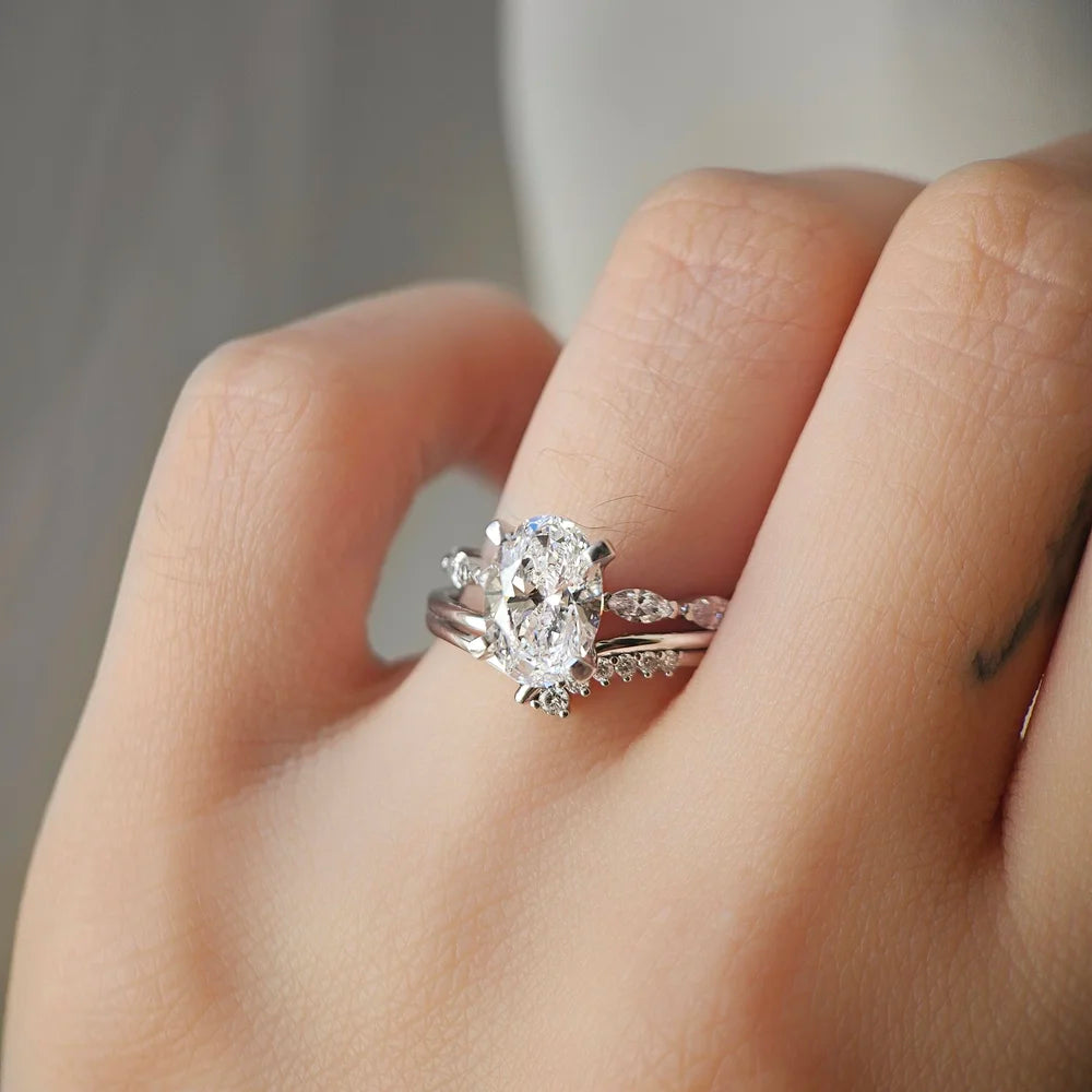 18K Odette Solitaire Oval Moissanite Ring with Round & Marquise Band