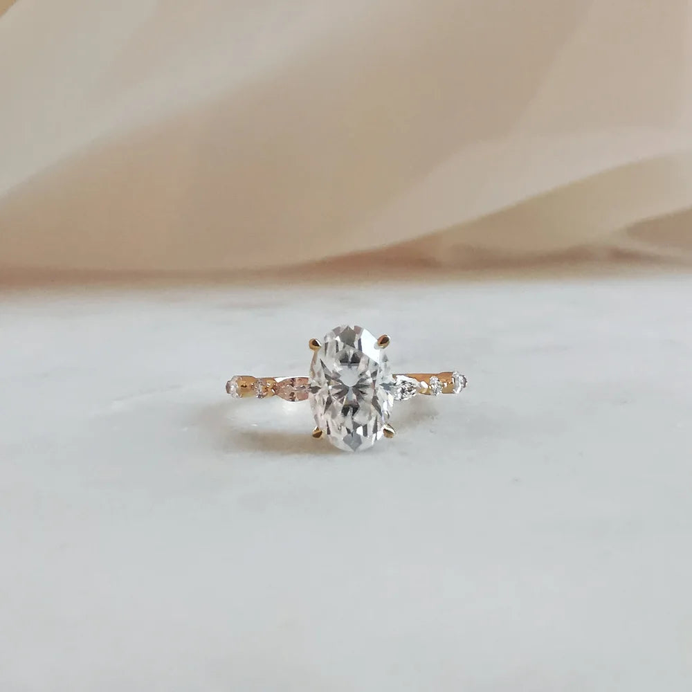 18K Odette Solitaire Oval Moissanite Ring with Round & Marquise Band