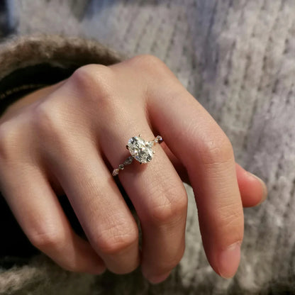 18K Odette Solitaire Oval Moissanite Ring with Round & Marquise Band