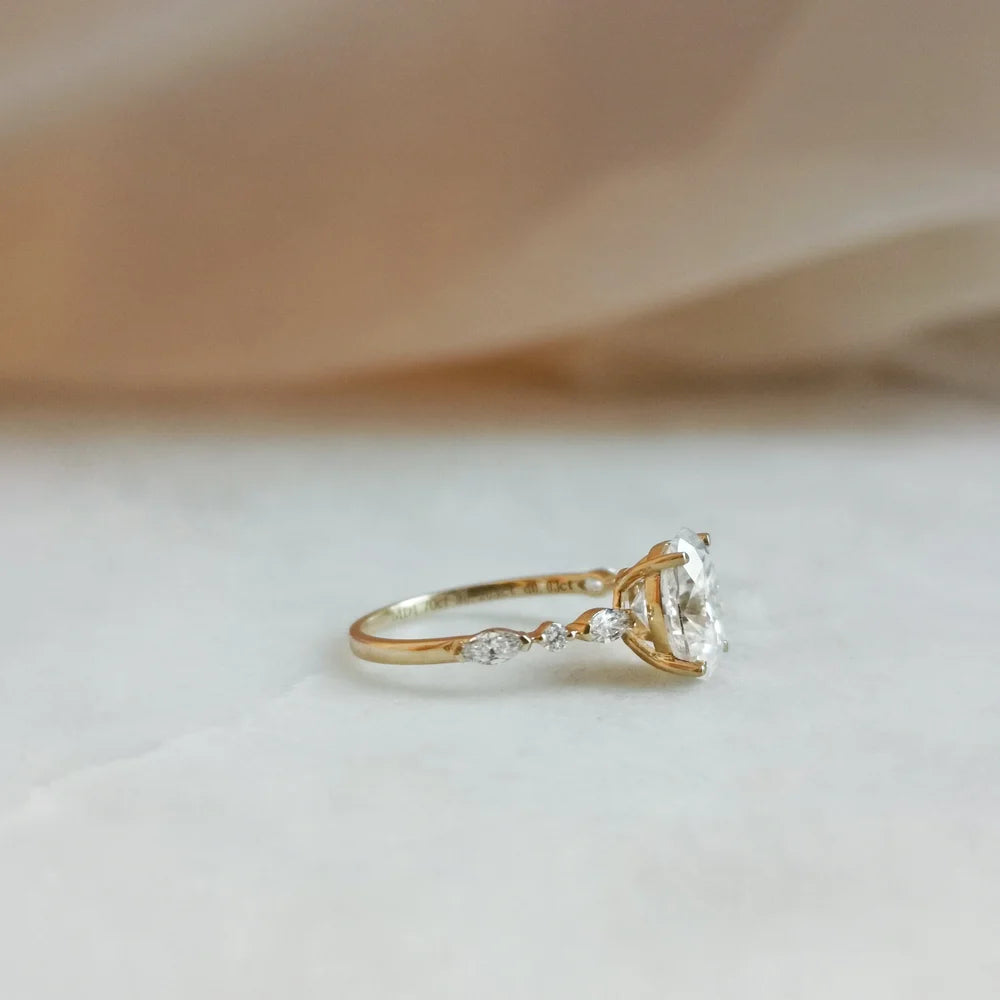 18K Odette Solitaire Oval Moissanite Ring with Round & Marquise Band