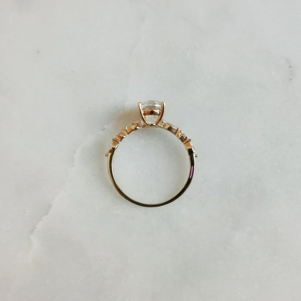 18K Odette Solitaire Oval Moissanite Ring with Round & Marquise Band