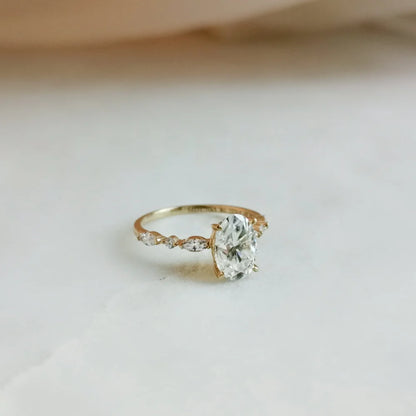 18K Odette Solitaire Oval Moissanite Ring with Round & Marquise Band