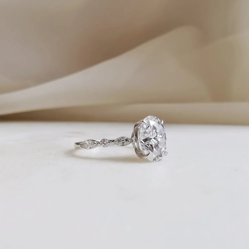 18K Odette Solitaire Oval Moissanite Ring with Round & Marquise Band